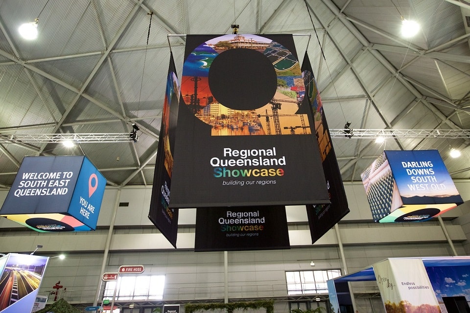 Hanging banners at Regional Queensland Showcase