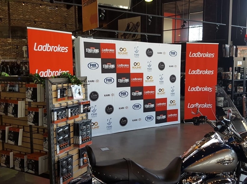 Media wall and pull up banner at a press conference